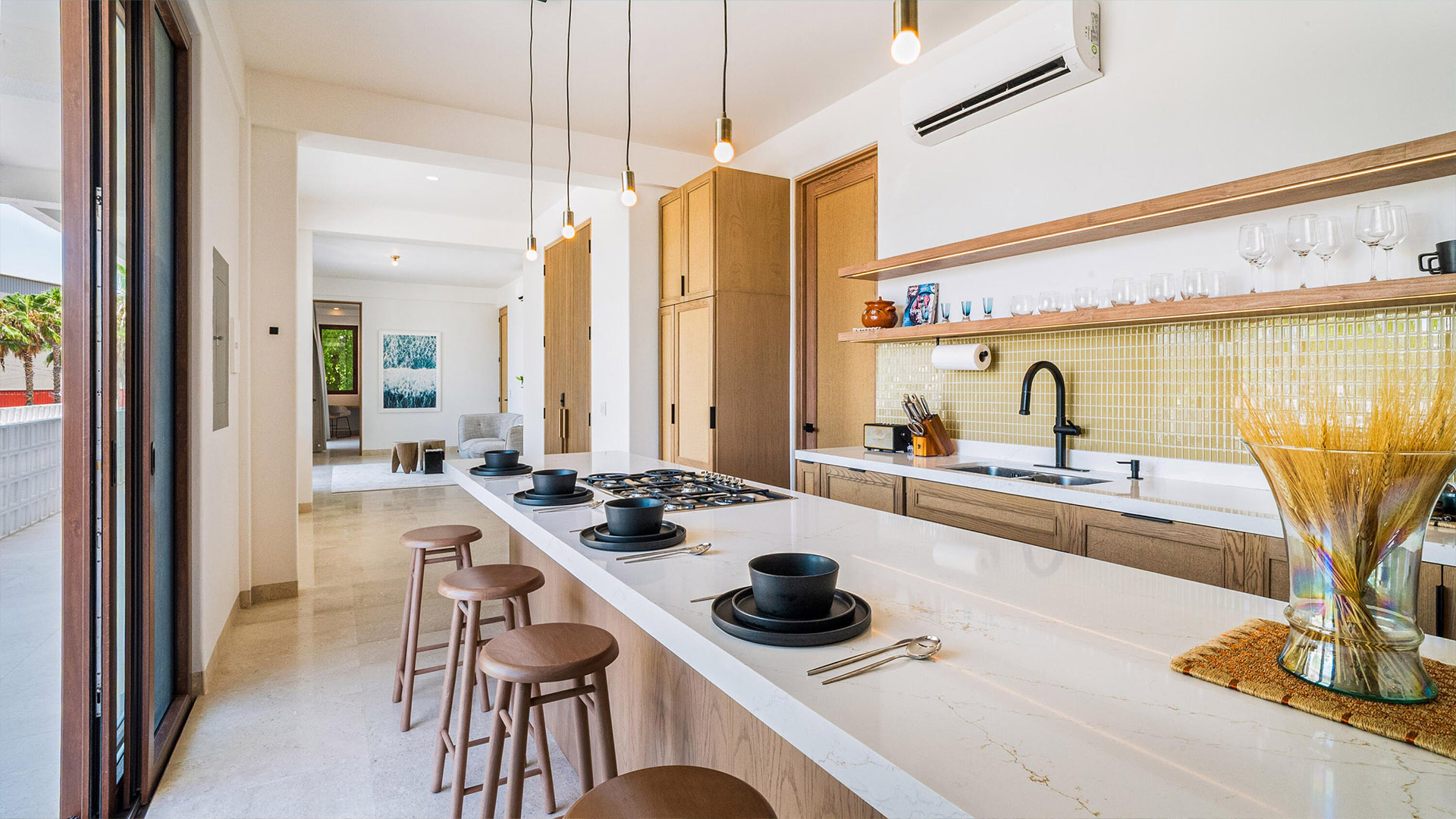 Contemporary luxury condo interior in San Jose del Cabo with ocean view and warm natural materials