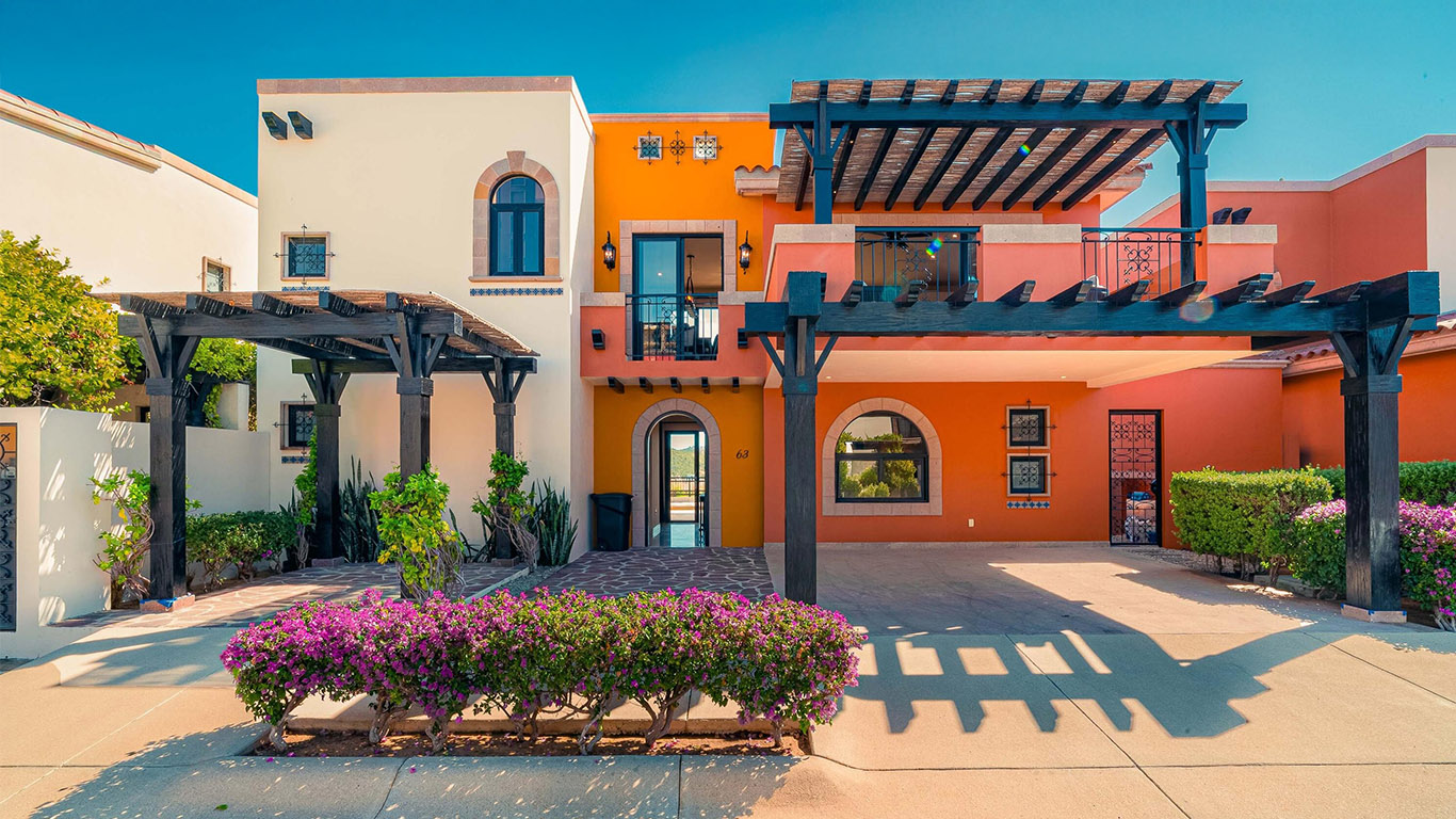 Open living room and terrace with ocean views at Copala Quivira Cabo