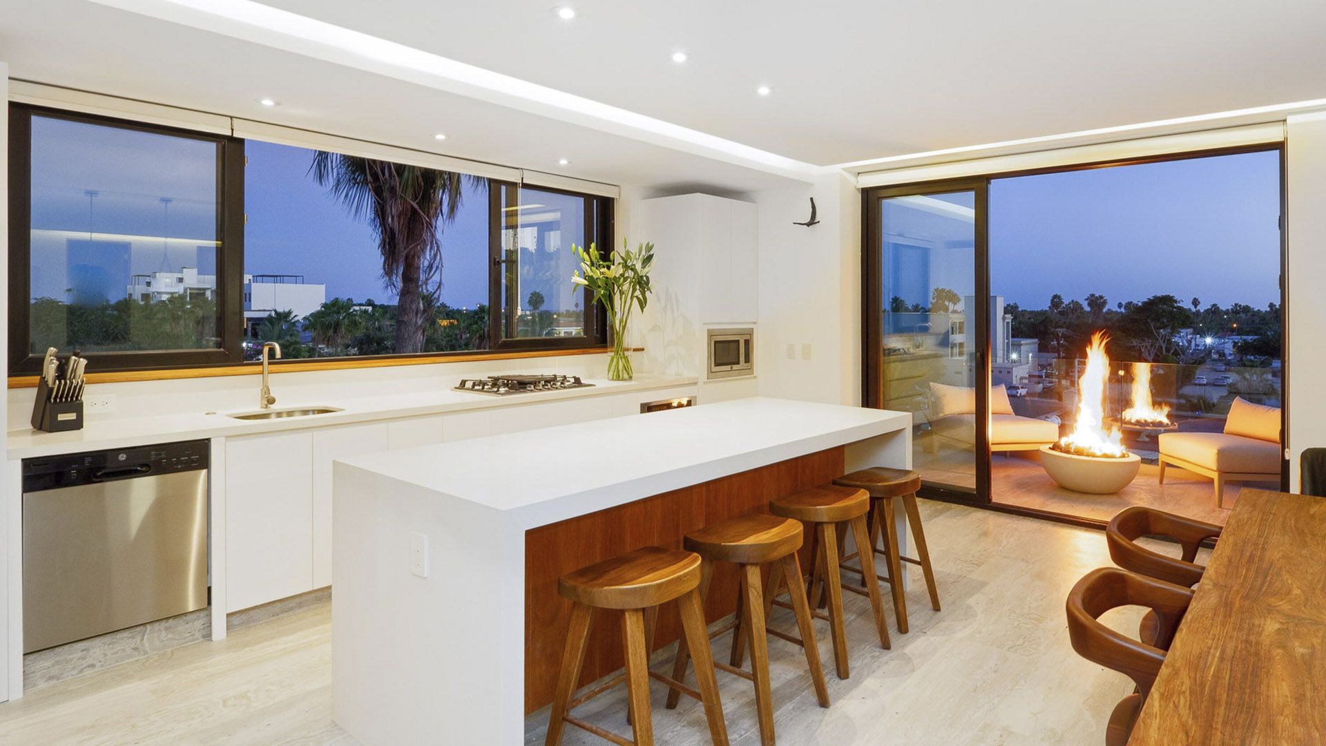 Cabo San Lucas Marina boardwalk near luxury condo buildings at dusk